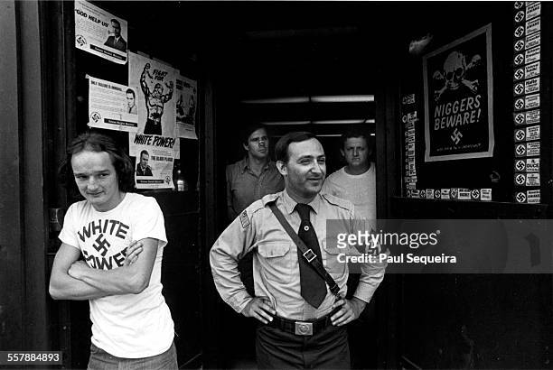 American neo-Nazi Frank Collin, of the National Socialist Party of America, stands with unidentified others outside of his organization's...