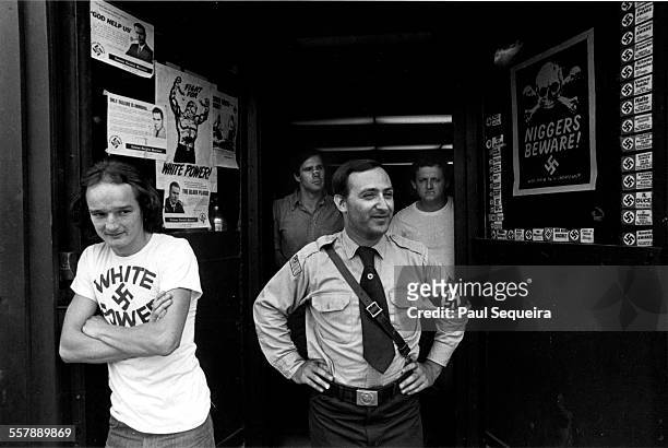 American neo-Nazi Frank Collin, of the National Socialist Party of America, stands with unidentified others outside of his organization's...