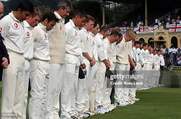 England and New Zealand players and officials observe a minutes silence for England player Ben Hollioake who was killed in a car crash in Perth,...