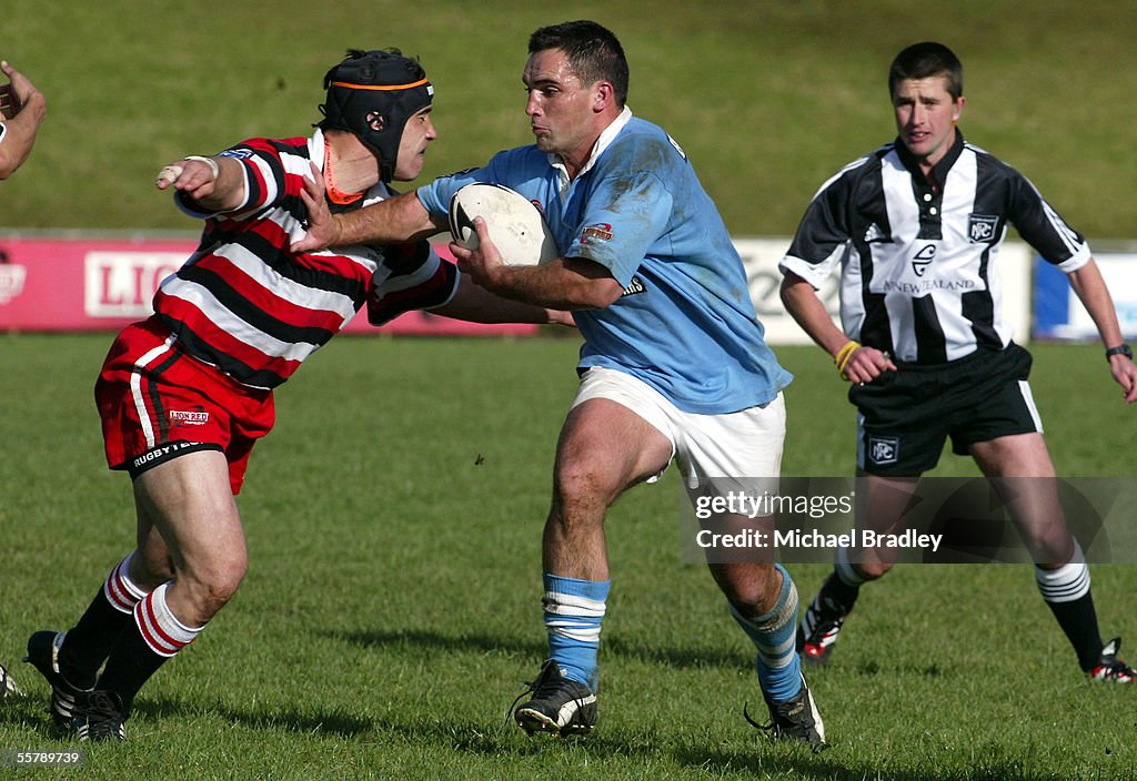 East Coast Marty Lloyd fends off the tackle from the Counties News Photo  - Getty Images