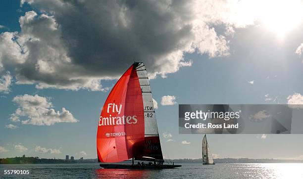 Emirates Team New Zealand yacht flies a spinaker during a sail on Aucklands' Waitemata Harbour, Monday June 14 to mark the announcement of Emirates'...
