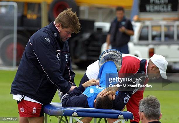 England cricket captain Nasser Hussain took a knock to his knee and gets some physio work done during batting practice at training prior to the one...