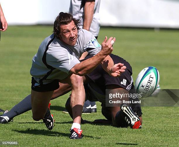 Halfback Byron Kelleher works on his pass during training at the Collingwood football club in Melbourne as the All Blacks prepare for their Rugby...