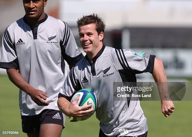 Halfback Steve Devine and Joe Rokocoko during a game of touch at training at the Collingwood football club in Melbourne as the All Blacks prepare for...