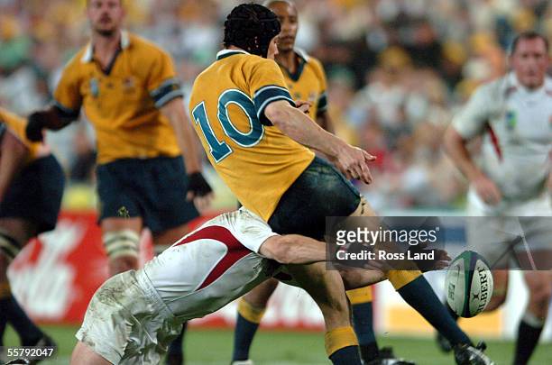 Halfback Matt Dawson puts pressure on Stephan Larkham during Englands 2017 win over Australia in extra time in the Rugby World Cup 2003 final at the...