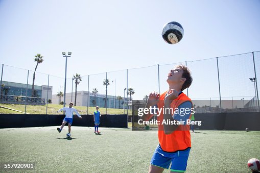 Boy practicing soccer header Boy practicing soccer header