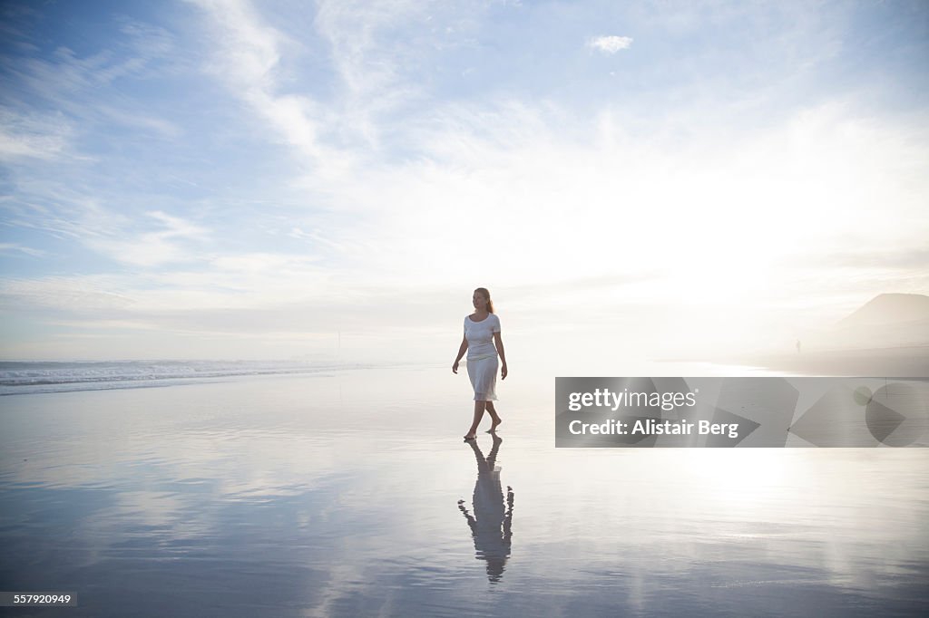 Woman walking on beach