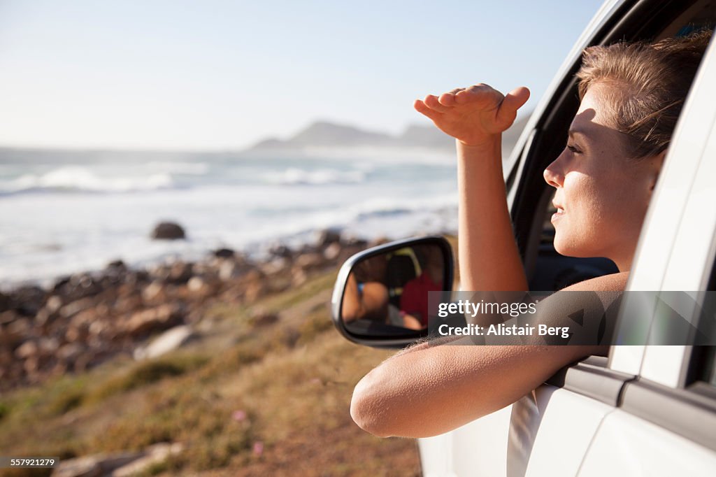 Woman looking out of a car window