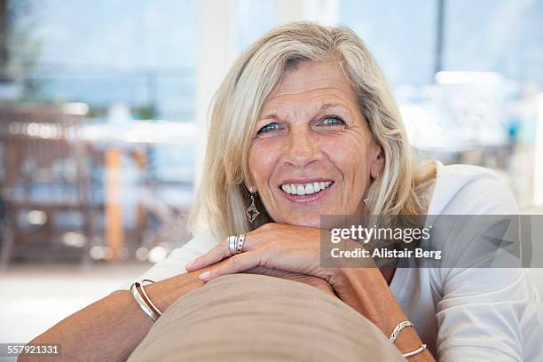 portrait of senior woman - female blonde blue eyes stock pictures, royalty-free photos & images