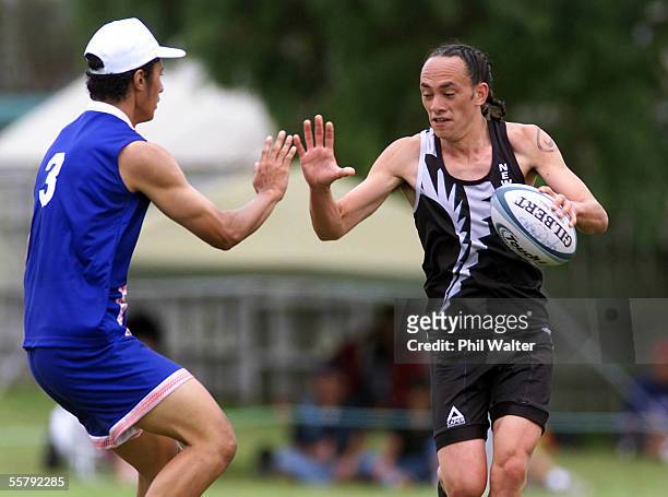 New Zealand's Bruce Kake about to be touched by Samoa's Ben Collins in their Mens U21 match in the Youth Touch World Cup played at Lloyd Elsmore...