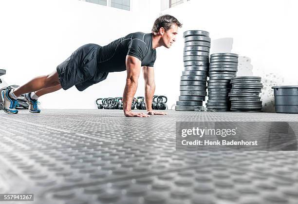 male doing pushups - push ups stock pictures, royalty-free photos & images