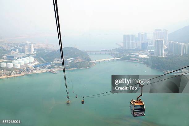 cable car to lantau island,hong kong. - overhead cable car stock pictures, royalty-free photos & images