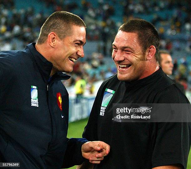 New Zealand born French player Tony Marsh and All Black Mark Hammett share a joke following New Zealand's' 4013 win over France in their Rugby World...