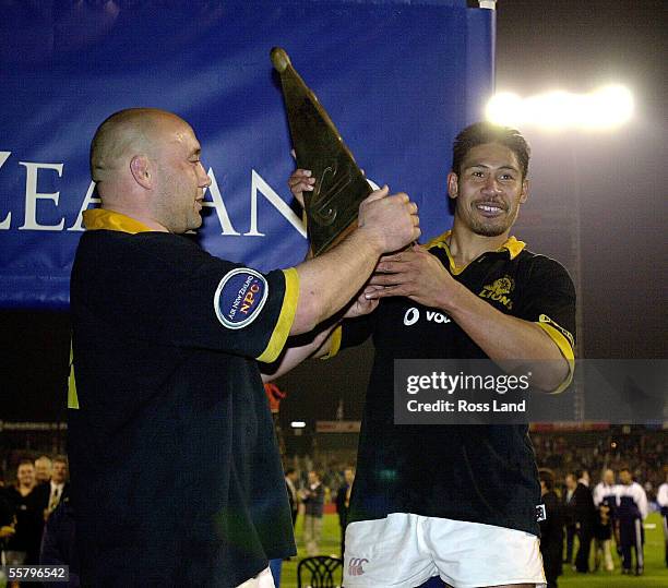 Norm Hewitt passes the spoils of victory to Alama Ieremia, after their team won the Air New Zealand NPC first division final 3429 over Canterbury at...