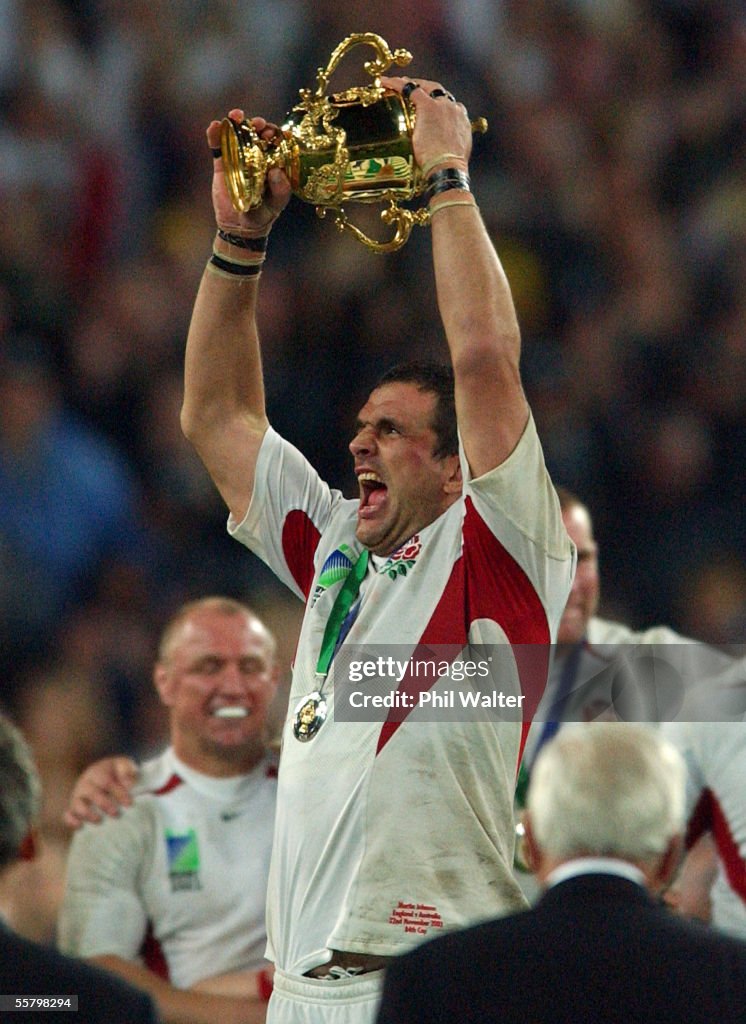 England's captain Martin Johnson holds up the Will
