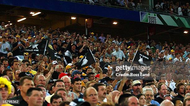 All Black supporters in the crowd before New Zealand's Rugby World Cup 2003 semi final match against the Wallabies at the Sydney Olympic Stadium,...