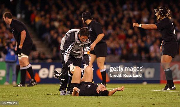 All Black Doctor John Mayhew treats Daniel Carter's injury during the All Blacks 707 win over Italy in their Rugby World Cup match at the Telstra...