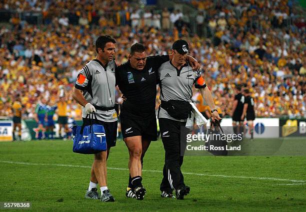 All Black Doctor John Mayhew and Physiotherapist Steve Muir help and injured Kees Meeuws from the field during the All Blacks 1022 loss to the...