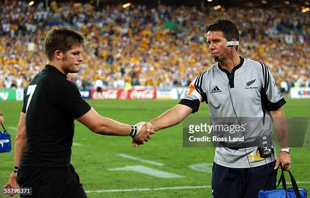 All Black Doctor John Mayhew shakes the hand of a disappointed Richie McCaw following the All Blacks 1022 loss to the Wallabies in the Rugby World...