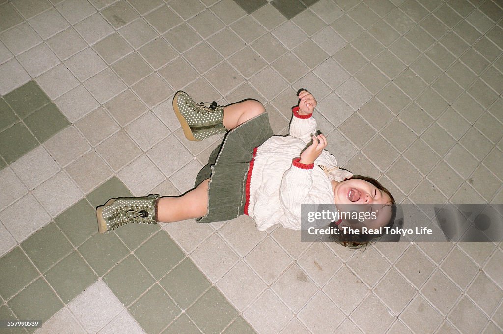 Crying baby on the floor