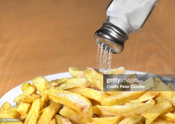 too much salt on chips - food dressing stock pictures, royalty-free photos & images