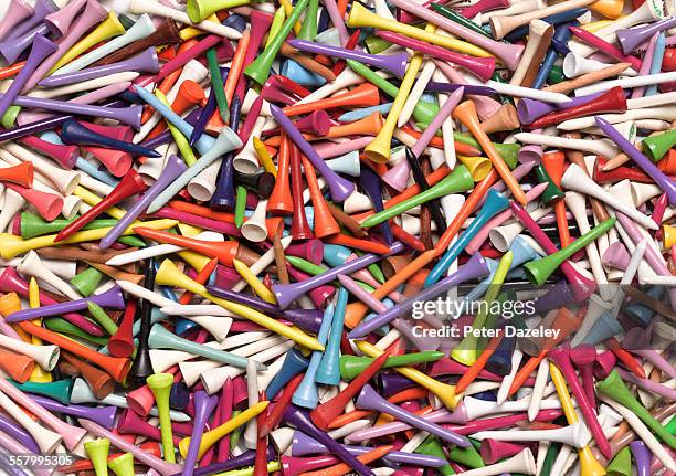 colourful golf tees full frame - golftee stock-fotos und bilder