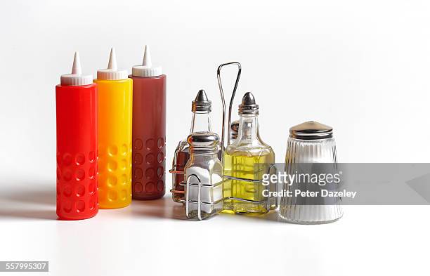 condiments on white background - salt seasoning stockfoto's en -beelden
