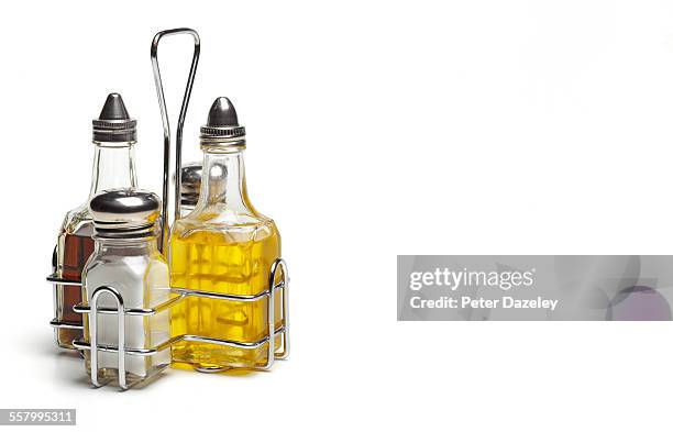 salt, pepper, olive oil and vinegar - condimento fotografías e imágenes de stock