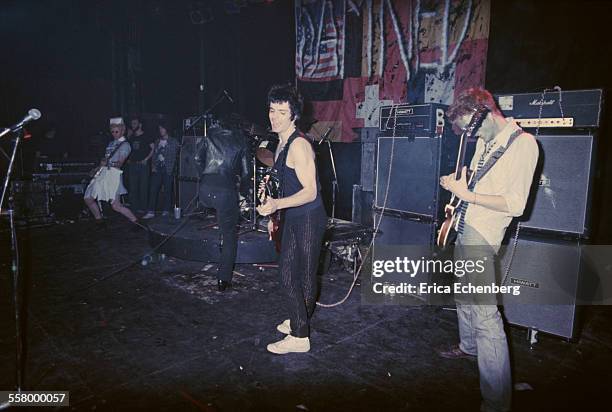 The Damned, with Lu Edmonds on guitar and Jon Moss on drums, perform on stage at The Roundhouse, Camden Town, London, United Kingdom, December 1977.