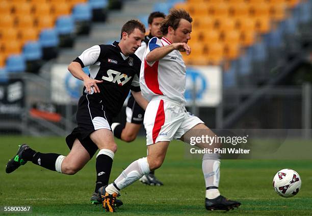 Newcastle United's Ryan Griffiths is in control ahead of Football Kingz Darren Young in their National Soccer League match played at Ericsson...