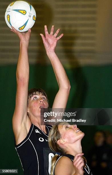 Silver Ferns Irene Van Dyk shoots at goal as Adine Harper looks on, during the Netball match between the New Zealand Silver Ferns and the Welsh...