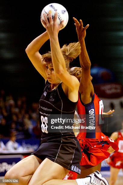 Silver Fern Irene Van Dyk secures the ball ahead of Englands Janet Coulbourne during the first netball test of the Fisher and Paykel Series between...