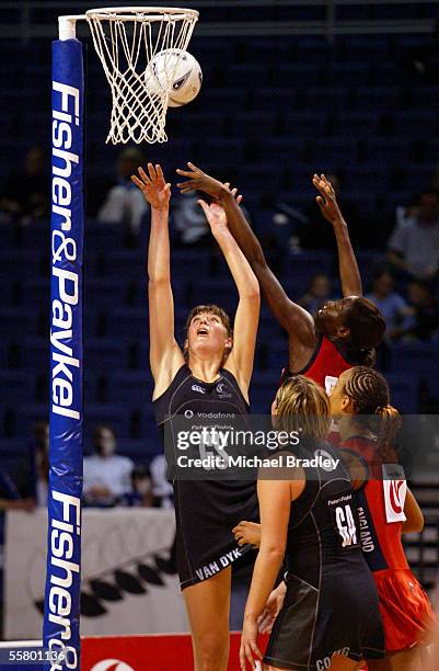 Silver Fern Irene Van Dyk puts up another shot under pressure from the English defence, during the first netball test of the Fisher and Paykel Series...