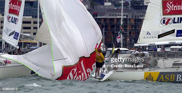 Team New Zealand member Bertrand Pace's stern is shrouded in the spinaker from Gavin Brady's boat, during Pace's defence of the Stienlager Line7...