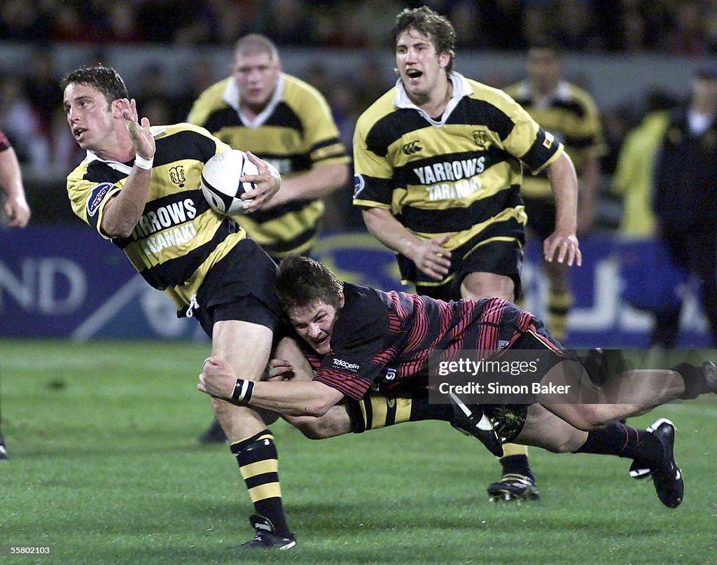Taranaki first five Mark Urwin is caught by Canter