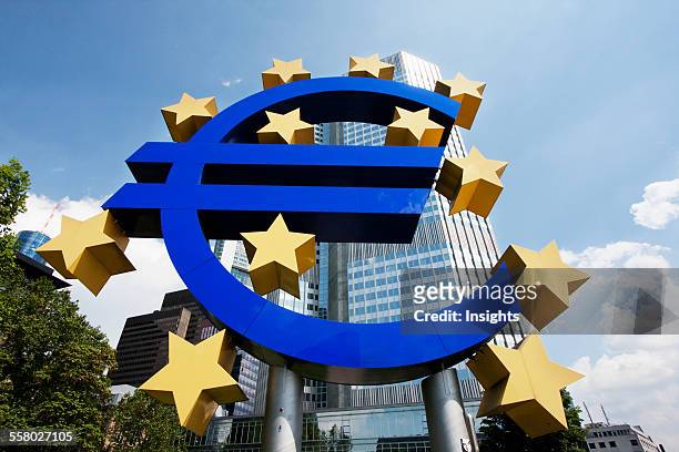 Euro Monument In Front Of The Eurotower, Headquarters Of The European Central Bank In Frankfurt Am Main, Germany