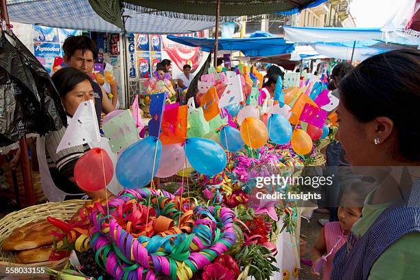 Gift Basket Vendor At The Jueves De Comadres Market During Carnaval Chapaco, Tarija, Bolivia