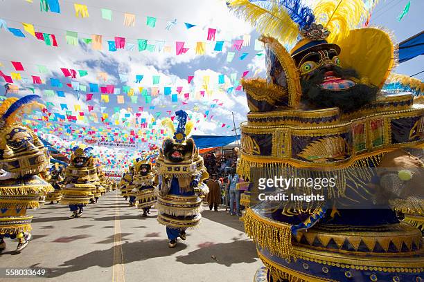 Morenada Dancers Wearing Elaborate Masks And Costumes In The Procession Of The Carnaval De Oruro, Oruro, Bolivia