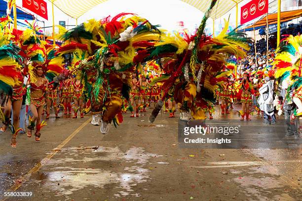Tobas Dancers Wearing Elaborate Masks, Feather Headdresses And Costumes In The Procession Of The Carnaval De Oruro, Oruro, Bolivia