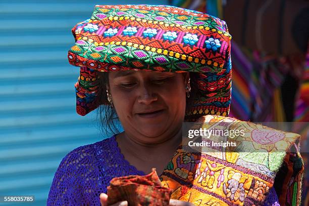 Maya Woman Selling Embroidered Table Cloths At The Sunday Market In Chichicastenango, El Quich