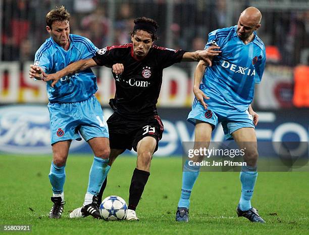 Paolo Guerrero of FC Bayern Munich and Olivier De Cock and Gregory Dufer of Bruges, challenge during the UEFA Champions League group A match between...