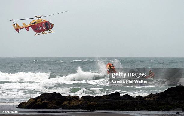 The Westpac Rescue helicopter carries out practice rescue operations with surf lifesaving teams during a training excersise in rough sea at Piha near...