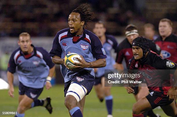 Bulls Odwa Ndungane leaves Crusaders Tony Kopelani behind in their Super 12 rugby match played at Jade Stadium in Christchurch, New Zealand,...