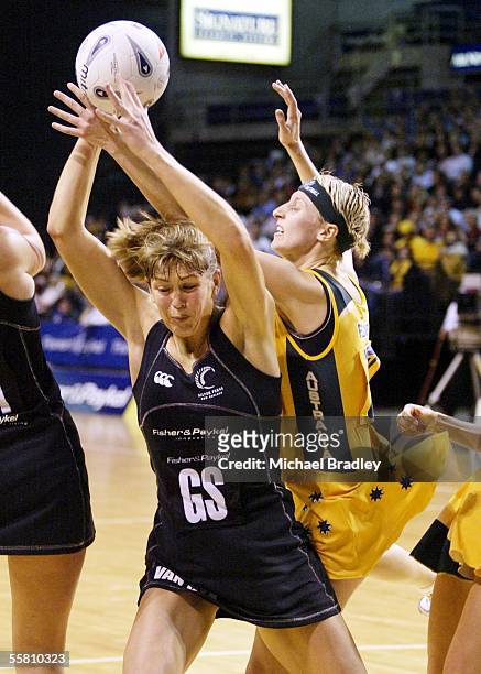 Australian Demelza Fellowes and Silver Fern Irene Van Dyk compete for the ball during the first Fisher and Paykel netball test between the Silver...