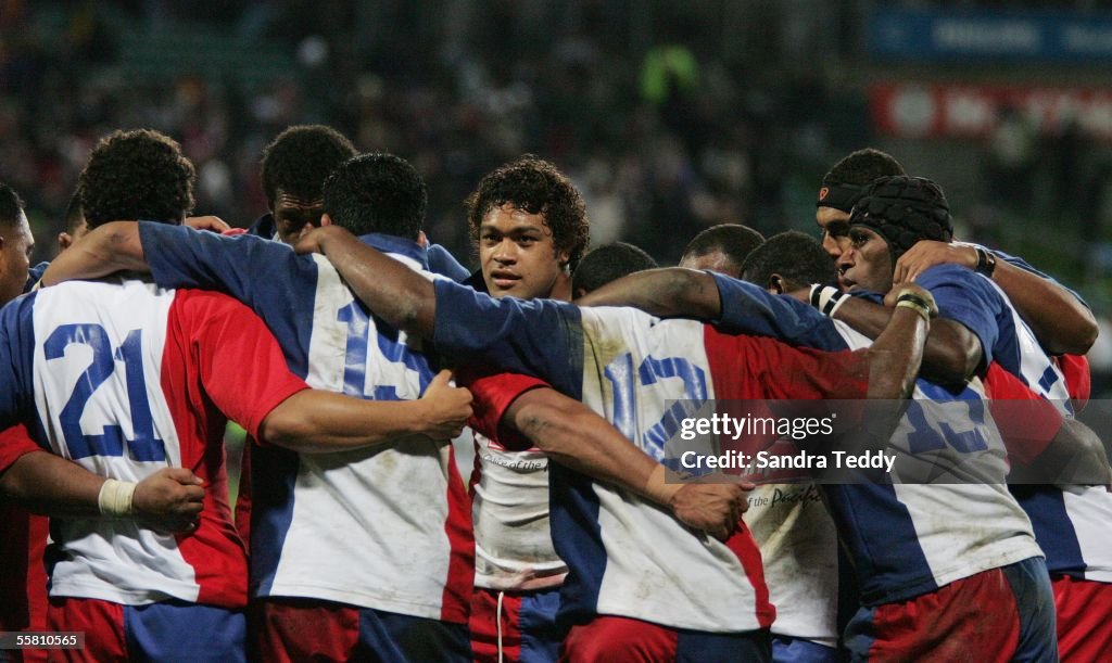 Pacific Islander Sione Lauaki gathers with the tea