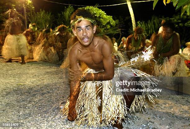 Prime Minister Helen Clark is entertained by dancers on shore at Nukunonu, Tokelau Sunday 09 August 2004 during a two day visit to Tokelau after the...