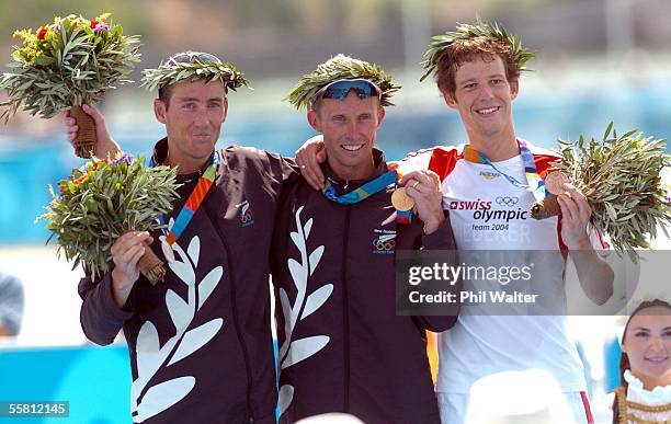 New Zealand's Hamish Carter and Bevan Docherty on the podium with Sweden's Sven Riederer after the Mens Triathlon at the Olympic Games in Athens,...