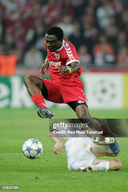 Armand Deumi of FC Thun jumps over Zdenek Pospech of Sparta Prague during the Champions League match between FC Thun and Sparta Prague at Stade de...