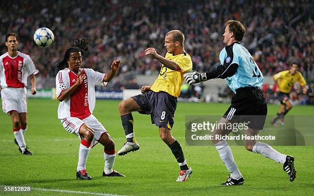 Fredrik Ljungberg of Arsenal chips over Urby Emanuelson of Ajax during the UEFA Champions League, Group B, match between Ajax and Arsenal at the...
