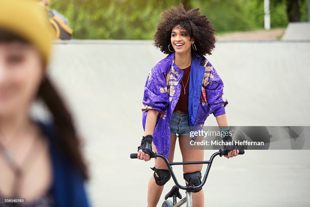 Young woman on BMX bike